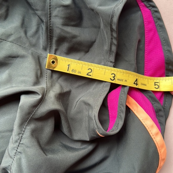 Nike DriFit running shorts in black with purple and orange trim - Picture 9 of 9